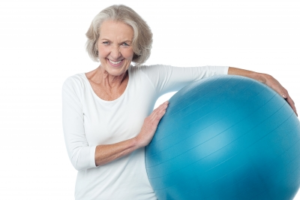 Senior women posing with exercise ball