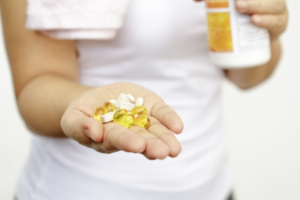 Woman-Hand-With-Vitamins